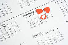 Calendar With Red Mark On February 14 And Little Red Paper Hearts. The Concept Of Valentine's Day.