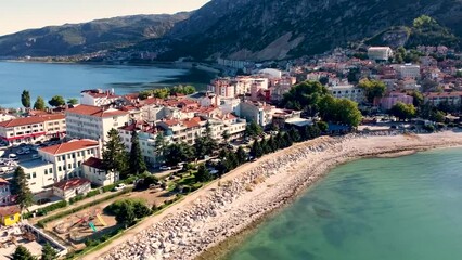 Wall Mural - Aerial cityscape view of a resort old town and blue sea or lake in the background