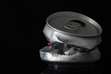 Crumpled Aluminum Can Isolated On Black