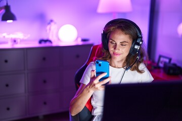 Poster - Young beautiful hispanic woman streamer using computer and smartphone at gaming room