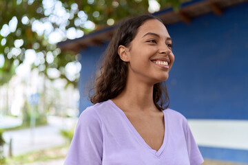 Poster - Young african american woman smiling confident looking to the side at street