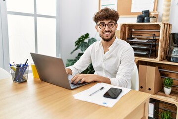 Sticker - Young arab man using laptop working at office