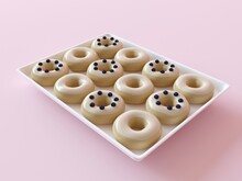 A White Tray With Donuts In The Assortment. Delicious Donuts In White Glaze And Blueberry Berries. Vanilla Milk Donuts, Cute Sweets On A Pink Background.