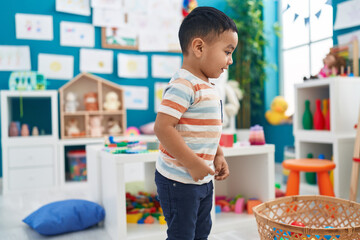 Wall Mural - Adorable hispanic toddler smiling confident standing at kindergarten