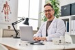 © Krakenimages.com - Young caucasian man doctor using laptop working at clinic