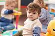 © Krakenimages.com - Group of kids playing with toys sitting on floor at kindergarten