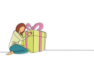 Wall Mural - Single one line drawing joyful caucasian woman hugging huge birthday gift. Young satisfied female sitting near wrapped birthday gift box with ribbon. Continuous line draw design vector illustration