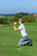 © ARochau - Emotionen beim Golfspiel - junger Golfer ärgert sich über einen unglücklichen Putt auf dem Green