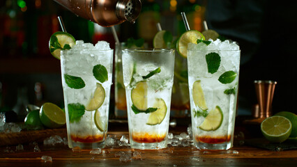 Wall Mural - Close-up of preparing mojito cocktail on a bar