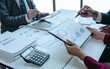 © M+Isolation+Photo - Team of businesspeople working with chart of accounts (COA) and balance sheet, stock market data, consulting asset accounts record any resources of company, anti bribery, error checking concept