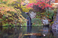 A Waterfall Inside Beautiful Autumn Trees	