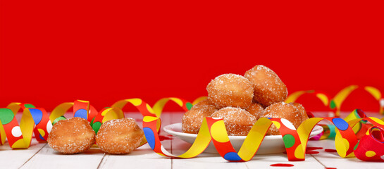 Wall Mural - Banner with small German traditional 'Berliner Pfannkuchen', a donut without hole filled with jam. Traditional served during carnival.