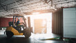 © NewSaetiew - Warehouse worker workers with forklift in a warehouse. Use forklift operator moves packages. Concept industrial and commercial.
