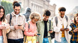 © Mirko Vitali - Multicultural happy friends having fun together with mobile phones at college campus - Tech life style concept with young guys and girls sharing funny video on smartphone device - Bright vivid filter