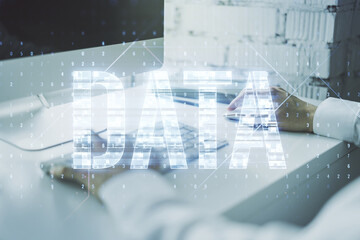 Wall Mural - creative data word sign and hands typing on laptop on background. multiexposure