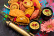 Indian Festival Of Colors Holi Is Celebrated With Colorful Gulal Abeer, Kesar Pista Badam Thandai, Gujiya, Mawa Potli Gujia, Chandrakala, Mithai, Water Gun, Dry Fruits, Bhang, Laung Latta, Samosa