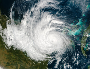 Hurricane from space, satellite view. Hurricane catastrophe. Elements of this image furnished by NASA. Selective focus. Noise and grain included.