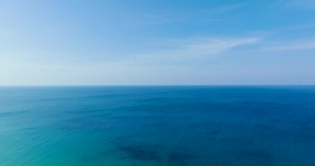 Wall Mural - Aerial view, sea horizon as far as the eye can see, blue water, blue sky on a clear day.