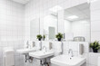 Leinwandbild Motiv Toilet hand wash area with white colour ceramic tiles. White colour theme toilet interior. Cleanliness concept