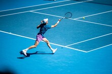 Professional Athlete Tennis Player Playing On A Court In A Tennis Tournament In Summer