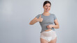 © Михаил Решетников - Woman in adult diapers smiling and showing thumbs up. Urinary incontinence problem.