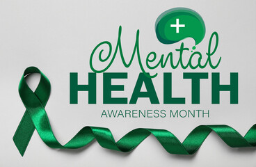 Green ribbon and text MENTAL HEALTH AWARENESS MONTH on light background