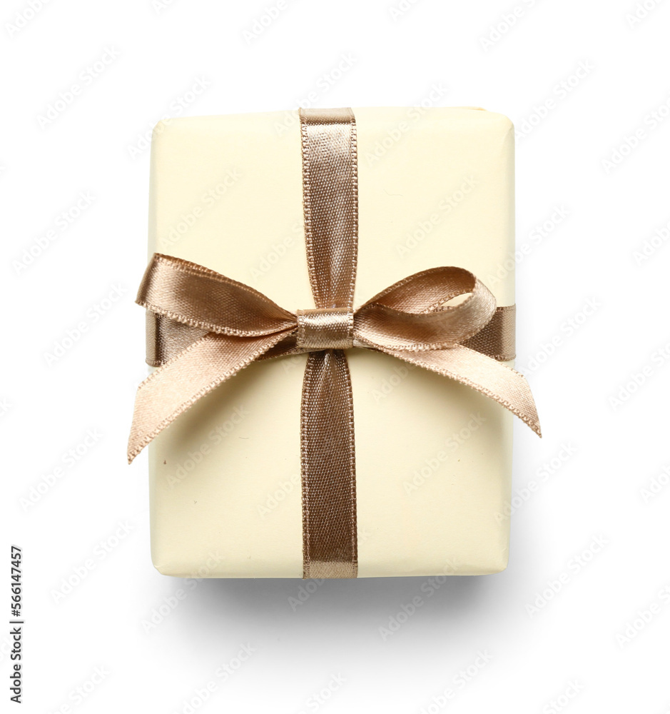 Gift box tied with silk ribbon on white background