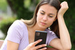 © Antonioguillem - Teen reading phone content