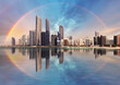 Rainbow over Abu Dhabi skyline with reflection in sea, United Arab Emirates - panorama