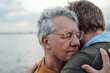 © Westend61 - Smiling senior man with gray hair hugging son