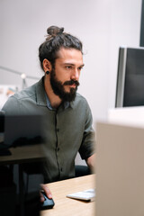 Concept of digital diagram,,programmer, software.Young finance analist working at modern office