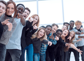 Wall Mural - close-up . team of happy young people pointing at you