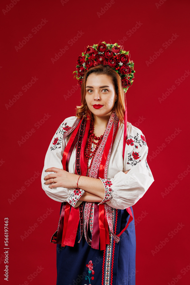 Photo Stock Portrait of ukrainian woman in traditional ethnic clothing and  floral red wreath on viva magenta studio background. Ukrainian national embroidered  dress call vyshyvanka. Pray for Ukraine | Adobe Stock