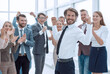 © ASDF - happy young businessman on business team background.