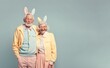 © Uncanny Valley - A romantic love date of a old grandparents couple in love at Easter pastel party with bunny ears, happiness and celebration. Illustration. Generative AI.