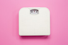 White Weight Scales On The Floor. Weight Measurement And Loss Concept