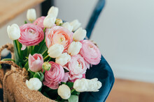 Beautiful Bouquet Of White Tulips And Pastel Pink And Peach Ranunculus In A Jute Bag.