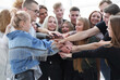 © ASDF - close up. a group of young people showing their unity.