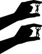 Silhouette of a hand holds between the fingers a woman who squirts. Bullying and inequality concept.