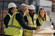 © Jacob Lund - Successful warehouse team watching a presentation on a laptop