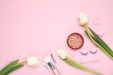 Wall Mural - Flowers tulip, makeup brushes, blush and eyelash on pink background