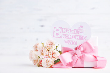 Canvas Print - Bouquet of roses, gift and card in shape of heart with text 8 March Women's Day on white wooden background