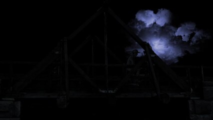 Wall Mural - old bridge with clouds lightning and people silhouette 4k loop features a night sky with lightning f