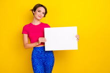 Photo Of Pretty Sweet Woman Dressed Pink T-shirt Holding White Placard Empty Space Isolated Yellow Color Background