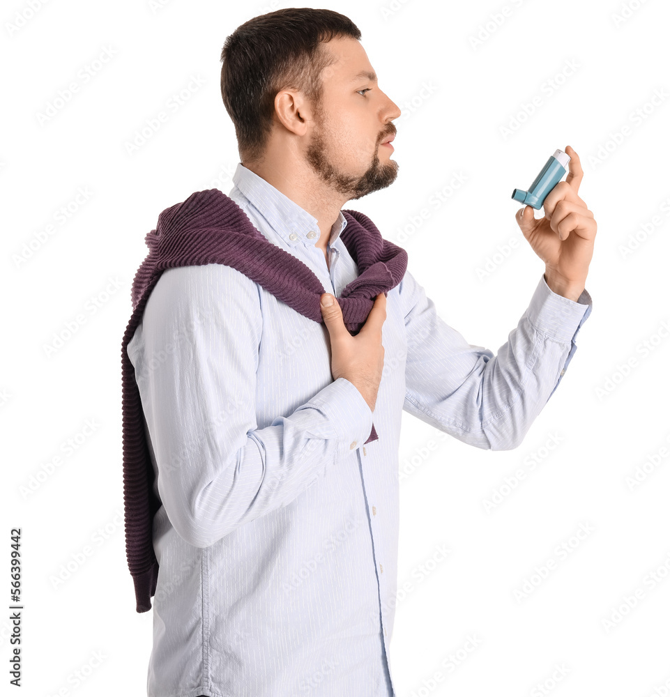 Sick man with inhaler on white background