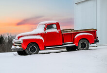 Old Vintage Red Farm Truck In The Snow