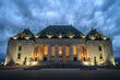 Supreme Court of Canada building in the evening under dark stormy sky
