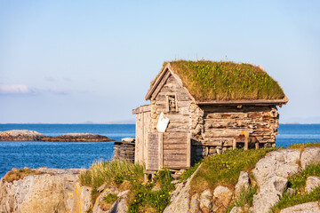 Wall Mural - Old log shed by the sea