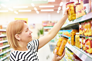 Sticker - Peaches in glass jar in hands woman in shop