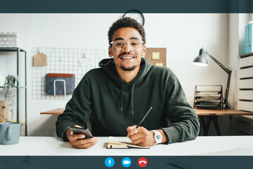 Video call conference screen. Handsome black man working remote